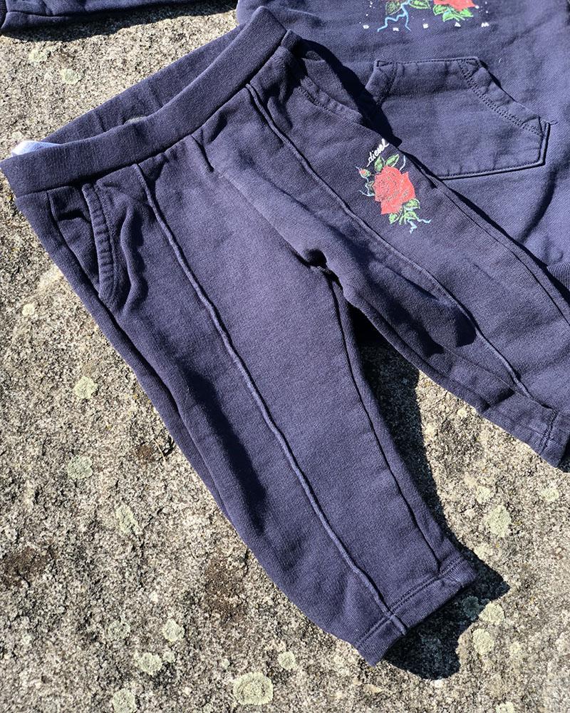 Diesel children's sweatpants dark blue with a rose