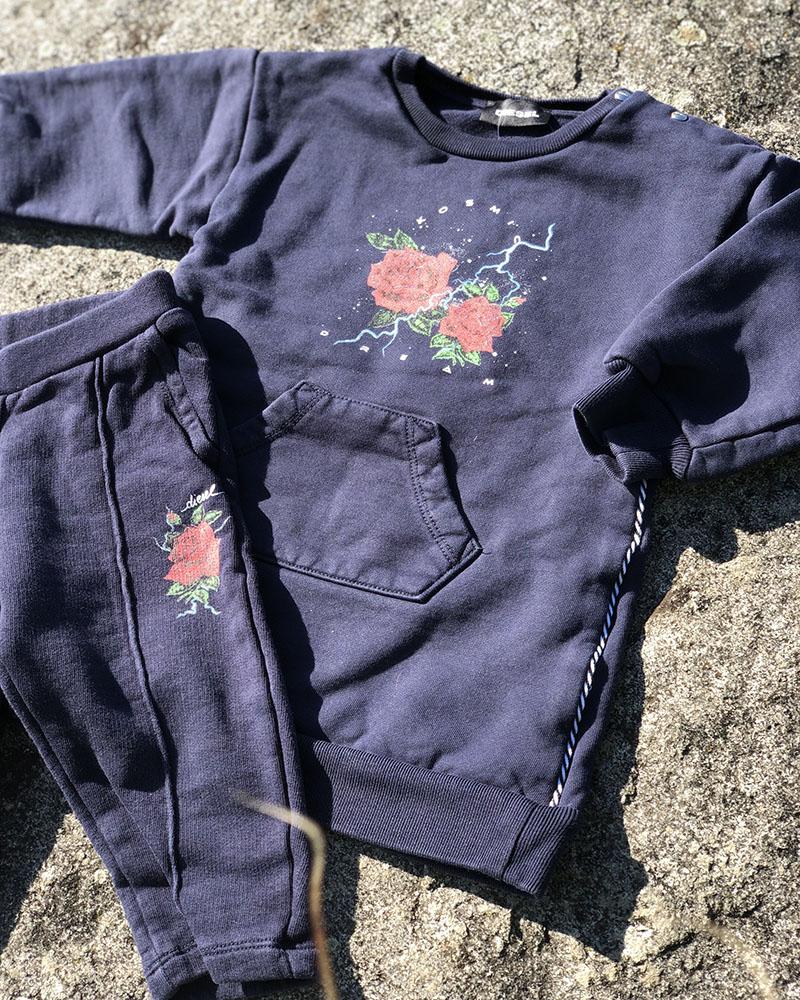 Diesel children's sweatpants dark blue with a rose