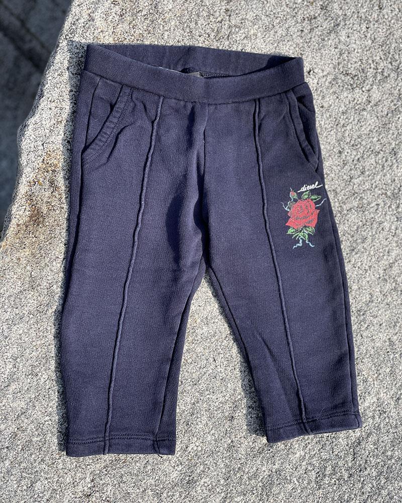 Diesel children's sweatpants dark blue with a rose